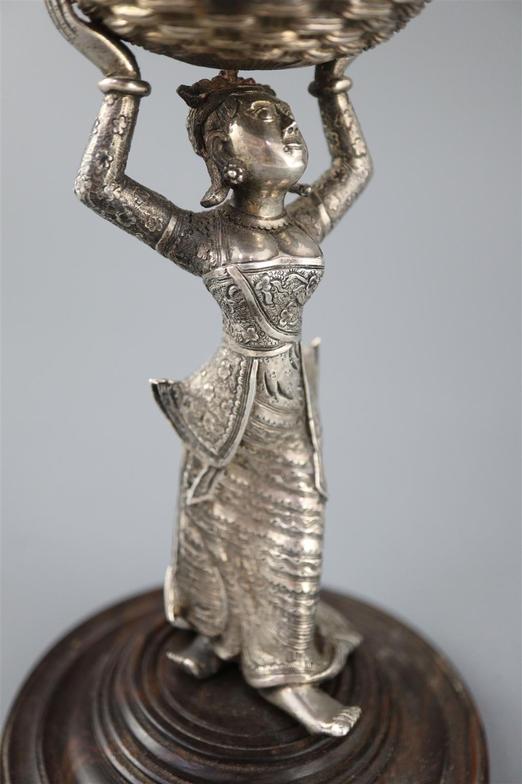 A 19th century Burmese engraved silver figural table salt,